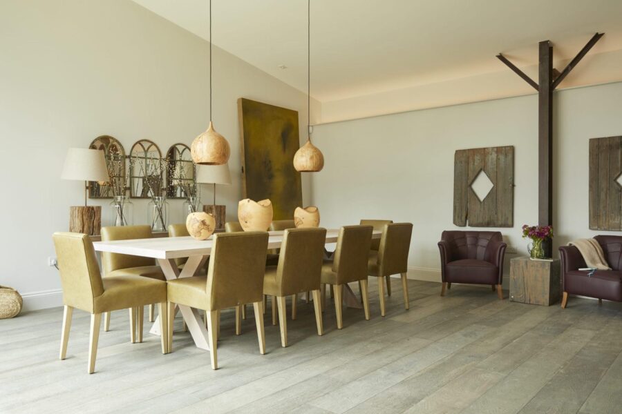 Bull Pen barn conversion dining area with hanging lamp shades