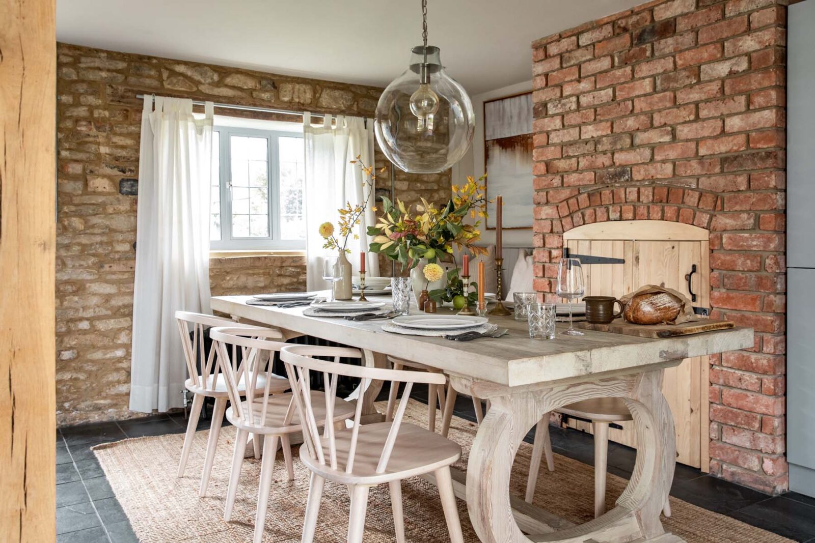 Cottage dining room with white furniture and flowers