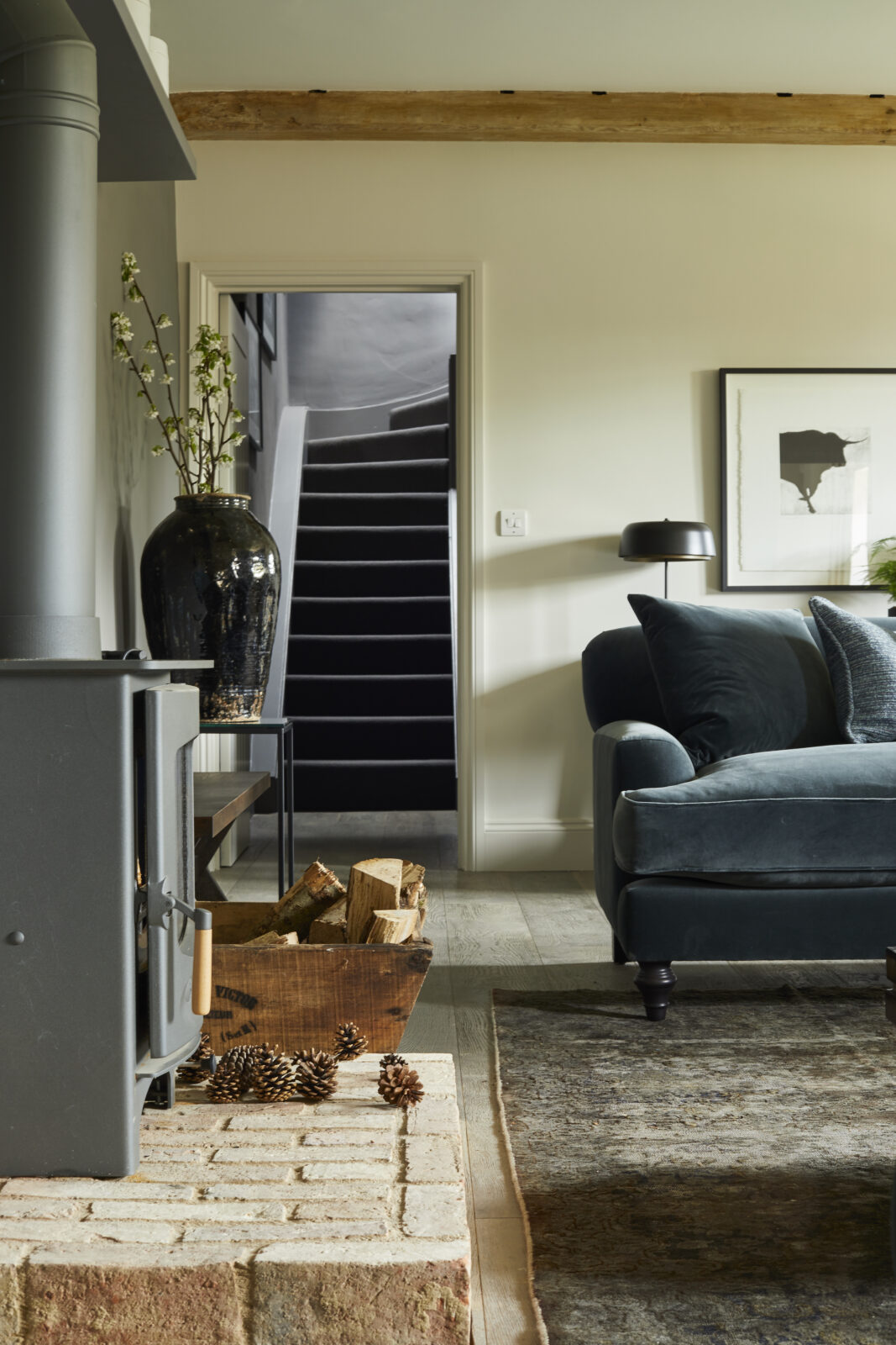 Blue sofa with log burner