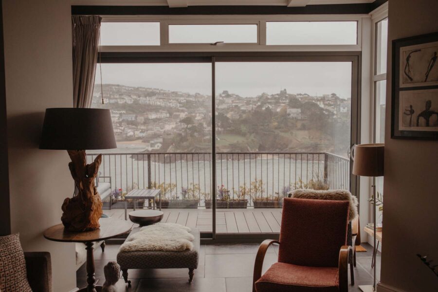 Cosy living apartment living area with a balcony terrace overlooking the harbour