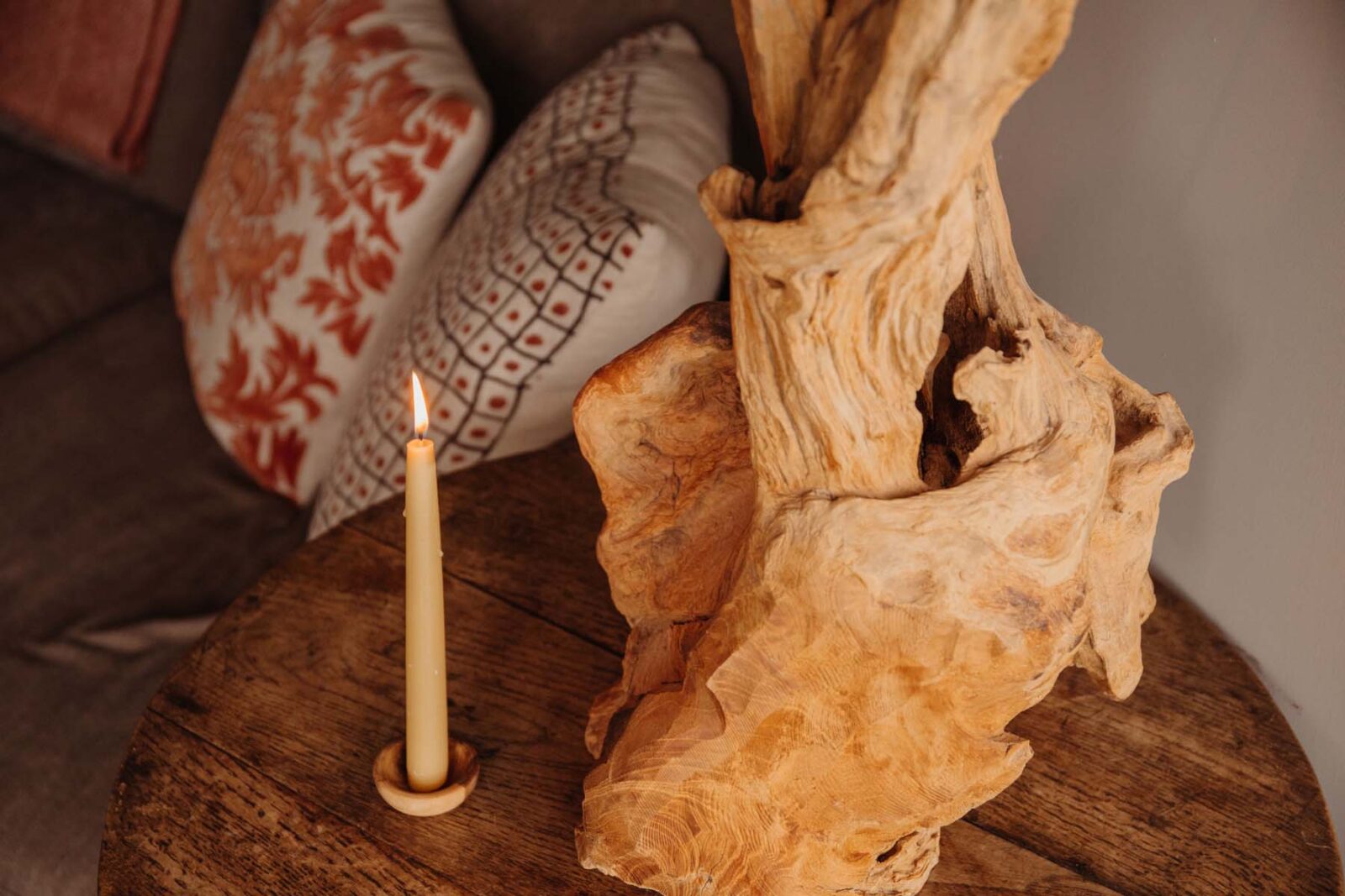 Candle by a sofa