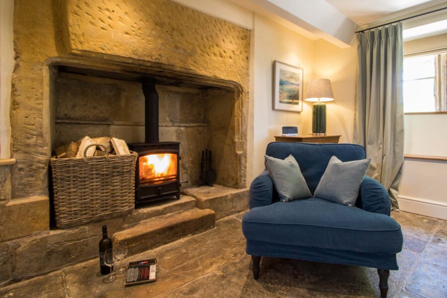 Wood burning stove with large armchair