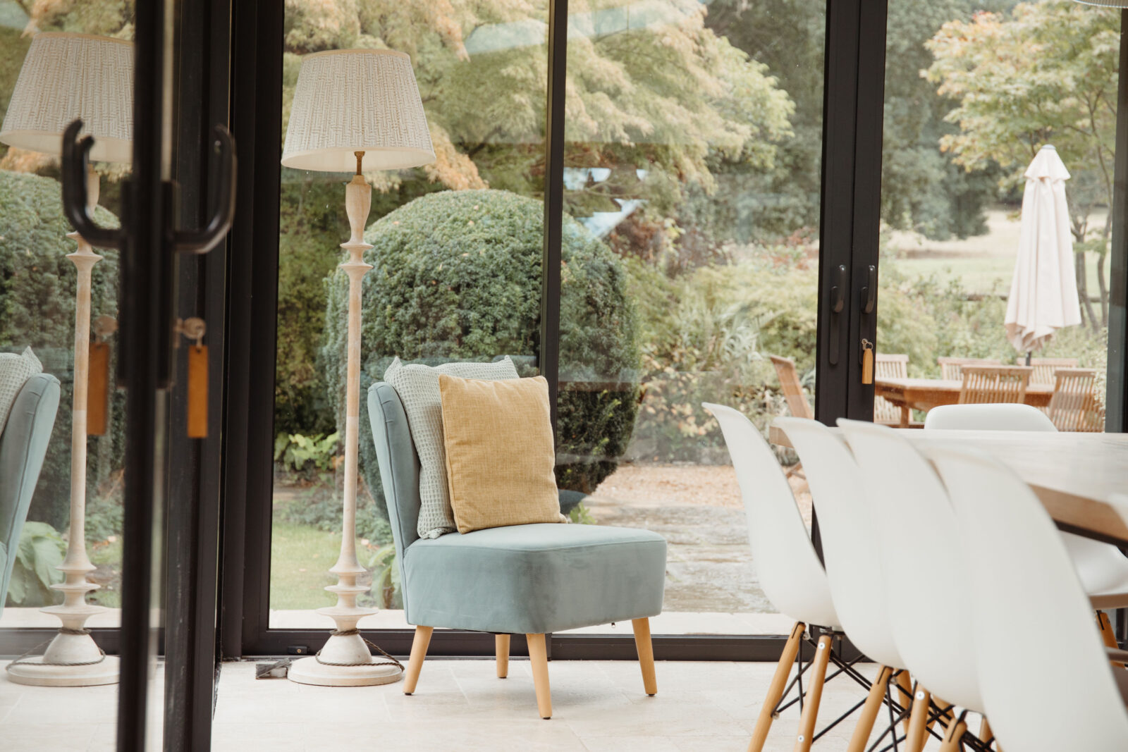 large window sun room with views of the garden