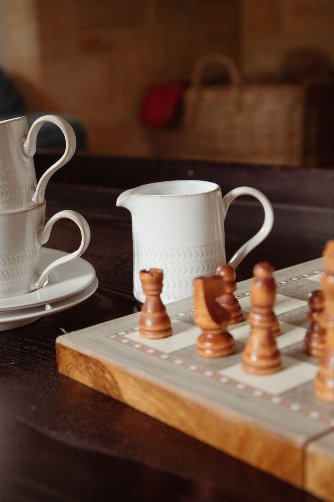 Corner of a chess board with wooden chess pieces