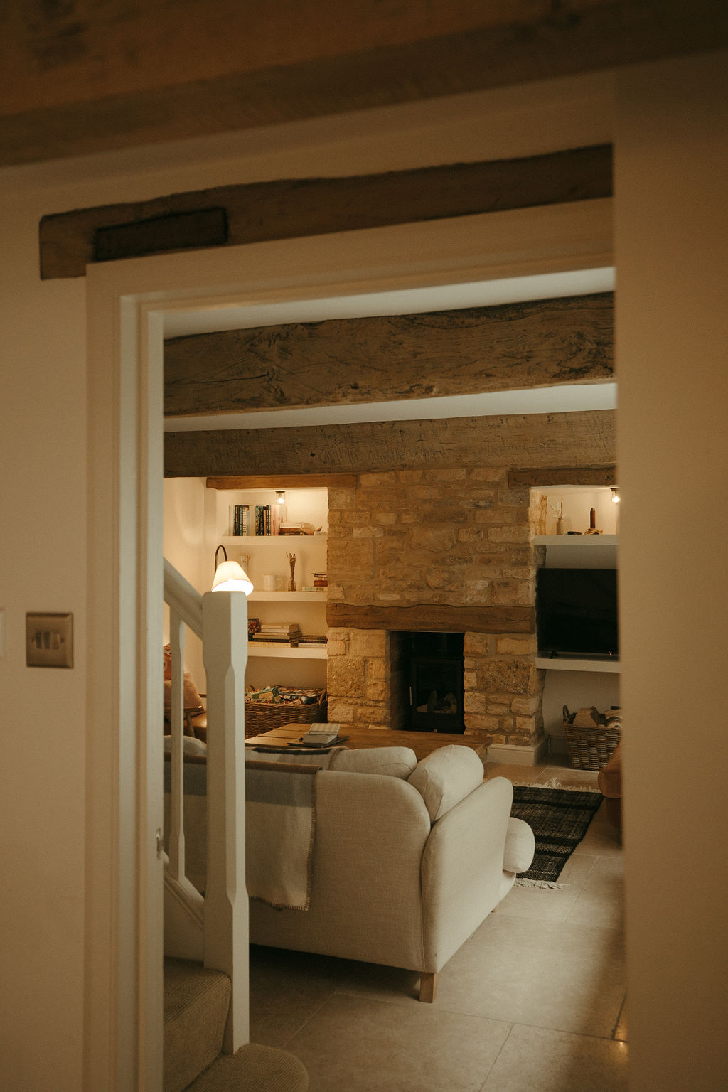 cosy cottage sitting room with open brick walls