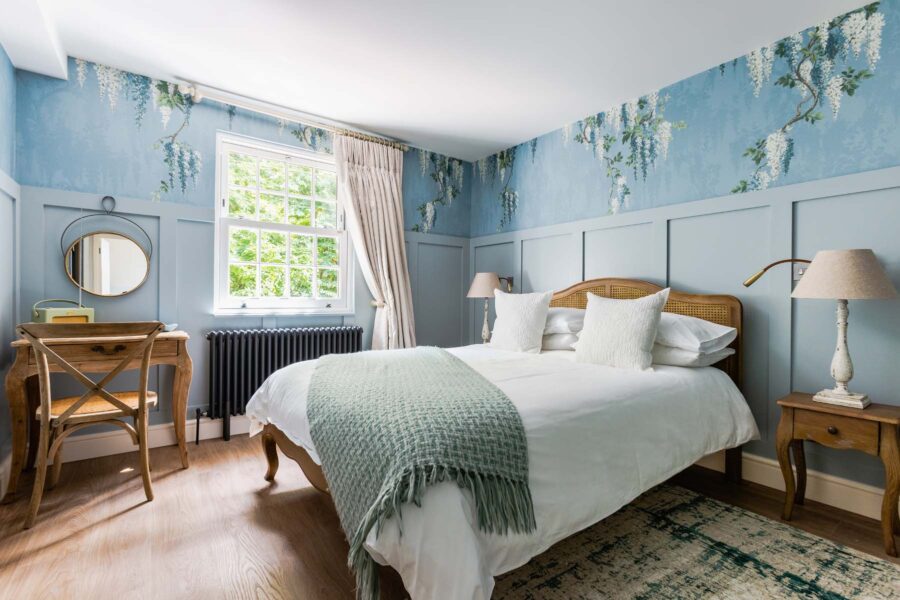Blue wisteria wallpaper king sized bedroom