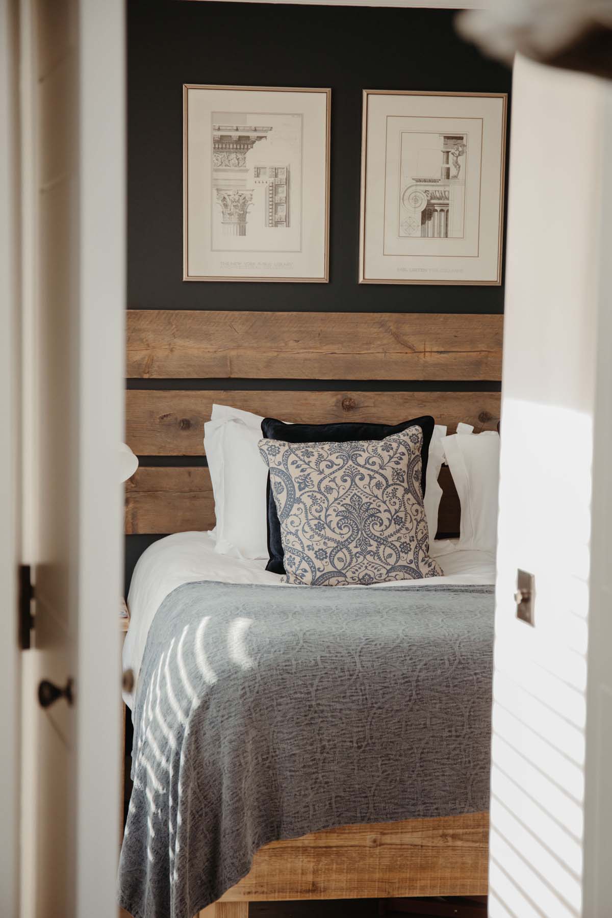 Bedroom with smart furnishings and wood cladding