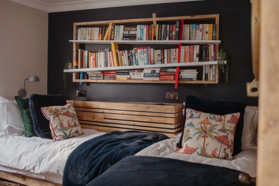 Kids bedroom with bookshelves on the wall