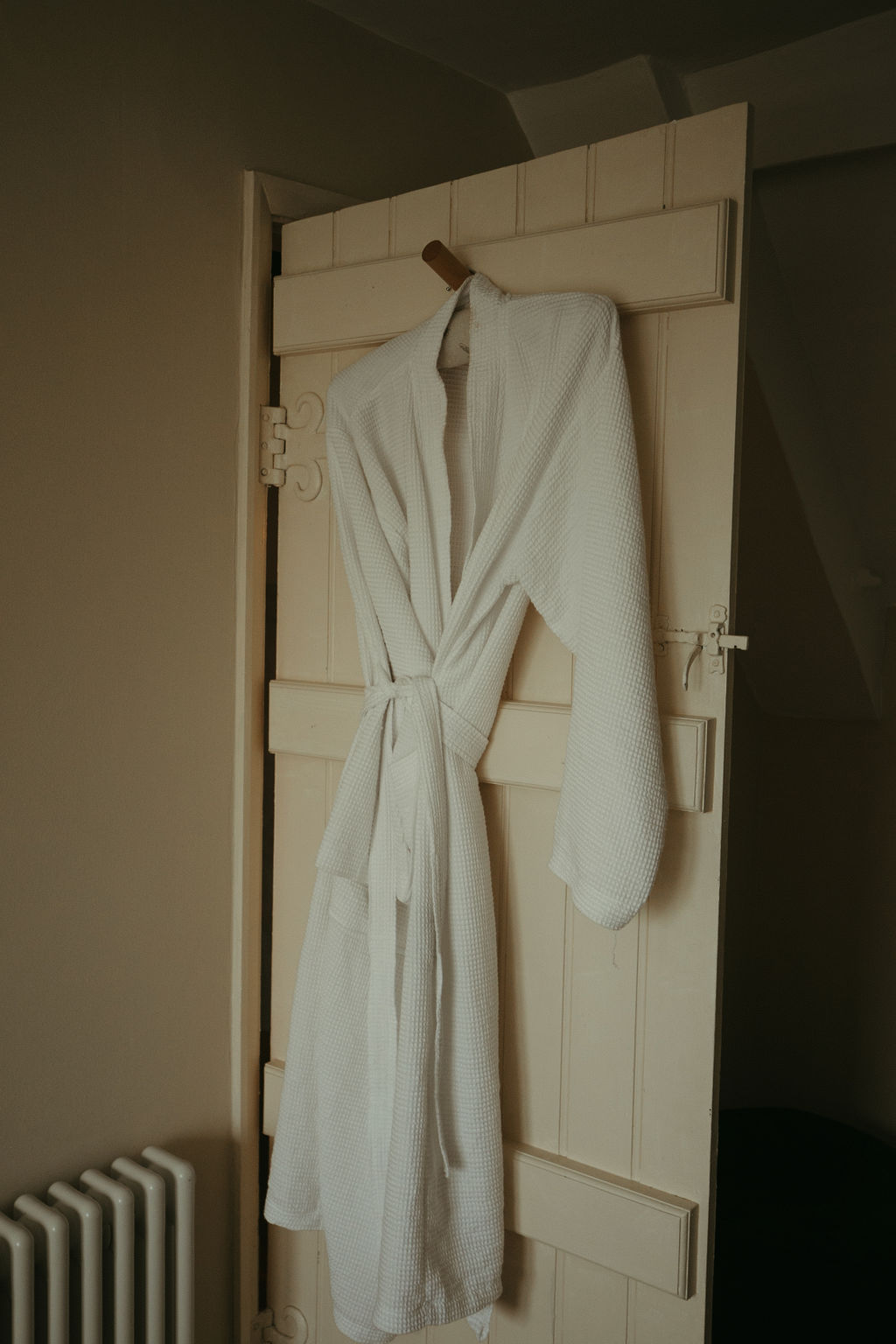 dressing gown hanging on back of door