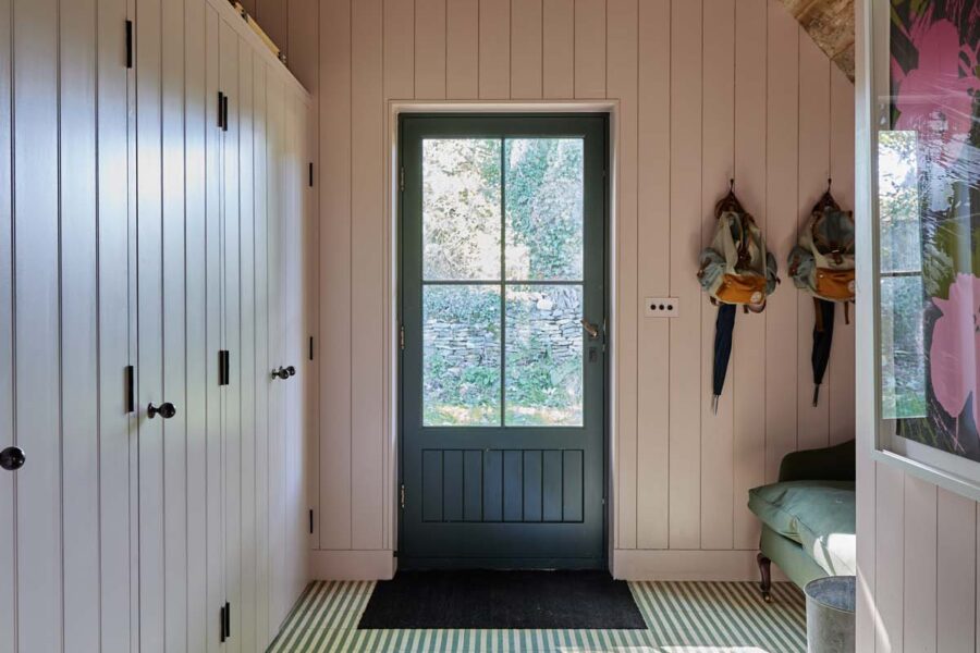 Entrance hall with striped floor and coat hangers