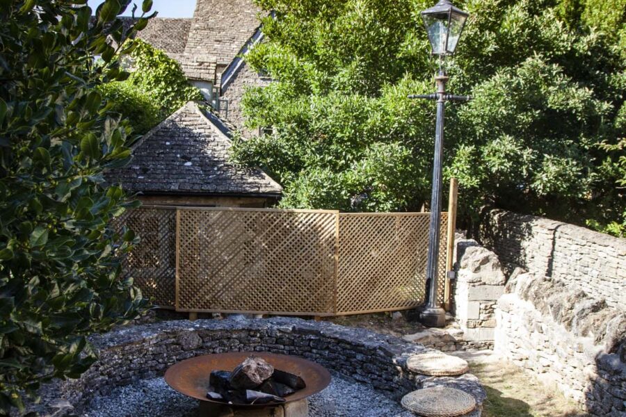 fire pit and surrounding seat cushions with blue sky
