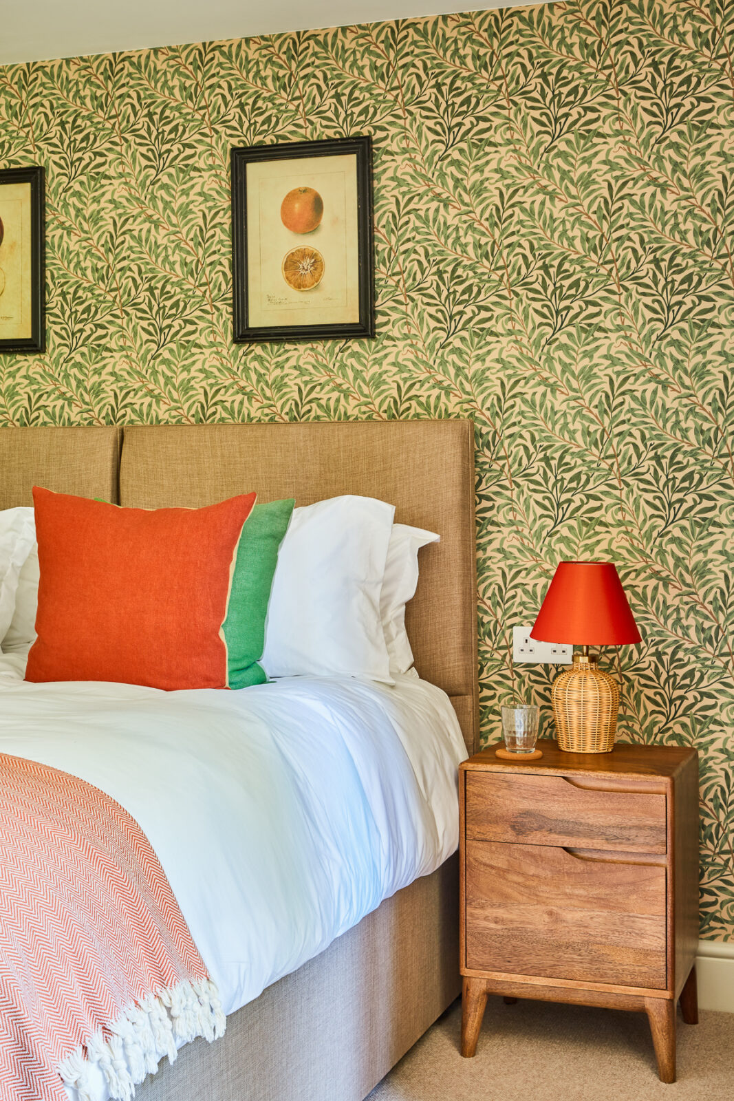 double bedroom with decorative green flower wallpaper